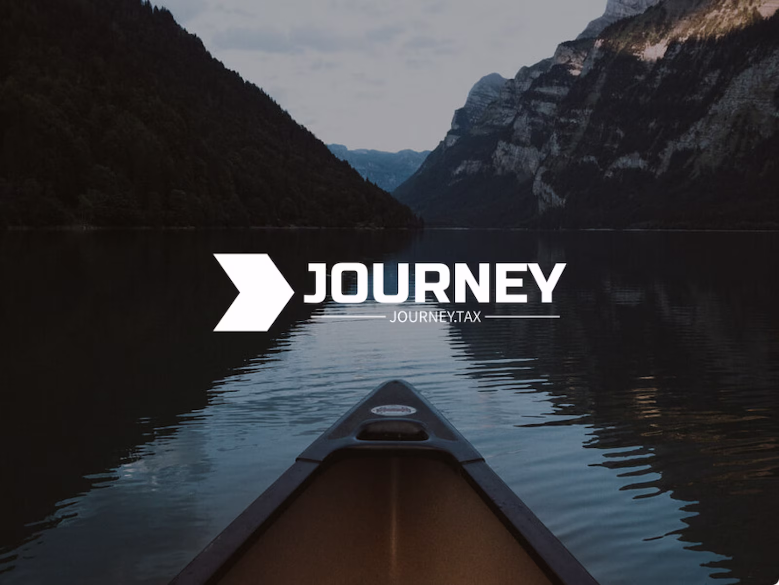Canoe on a still mountain lake at dawn, the Journey brand